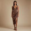 Full-length image of a woman wearing a FJØRNA satin midi dress with a smooth finish, sleeveless design, suitable for evening occasions.