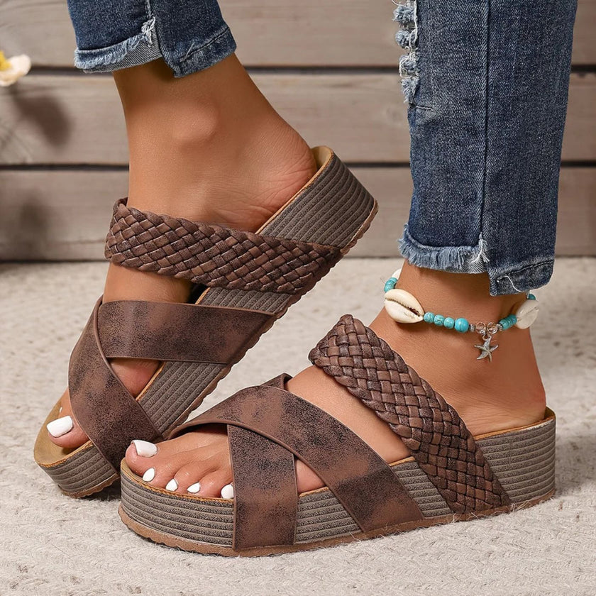 FJØRNA Abigail™ orthopedic leather strap sandals with cushioned soles, shown in black on a model's feet.