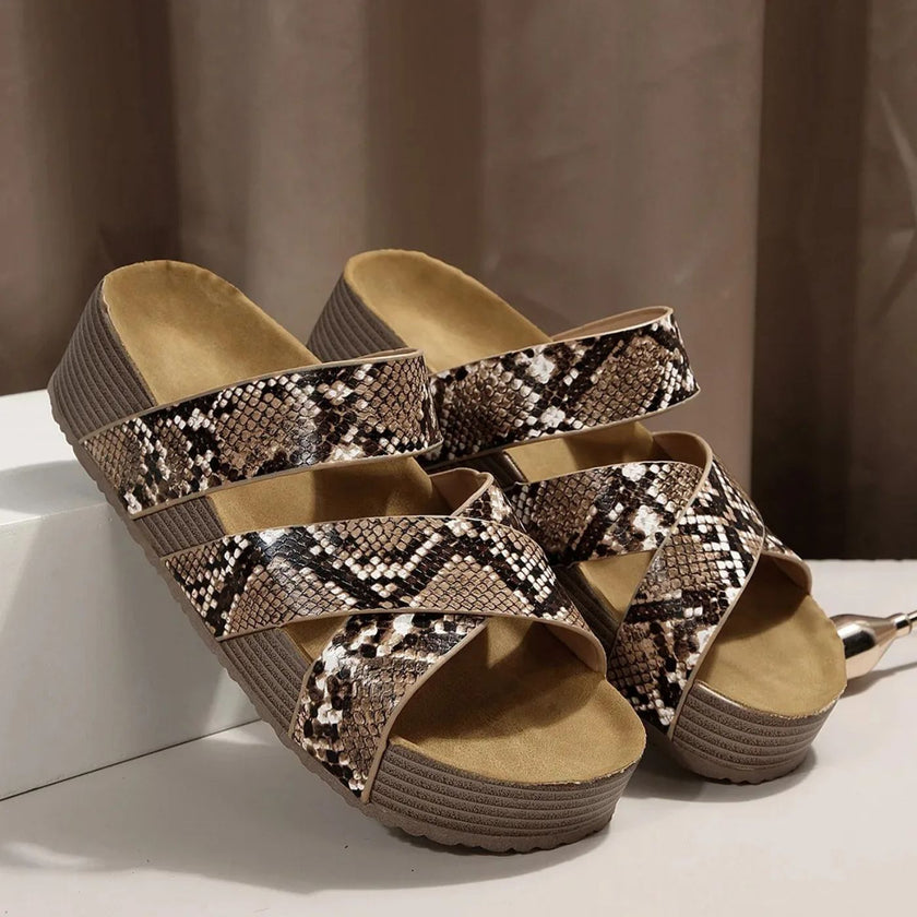 FJØRNA Abigail™ orthopedic leather strap sandals with adjustable straps and cushioned soles, shown in black on a model.