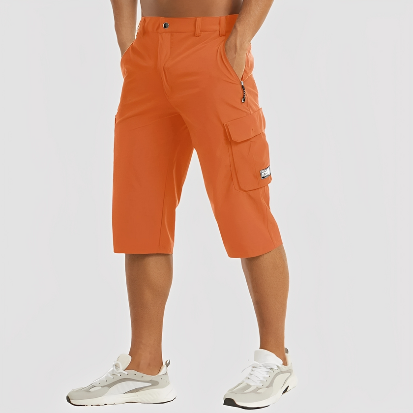 FJØRNA men's stretch cargo pants with multiple pockets, relaxed fit, and durable fabric for casual and outdoor wear.