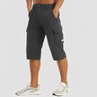 FJØRNA men's stretch cargo pants with multiple pockets and relaxed fit, designed for comfort and functional style.