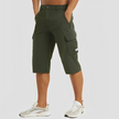 FJØRNA men's stretch cargo pants with multiple pockets, shown in a relaxed fit, ideal for casual and outdoor wear.