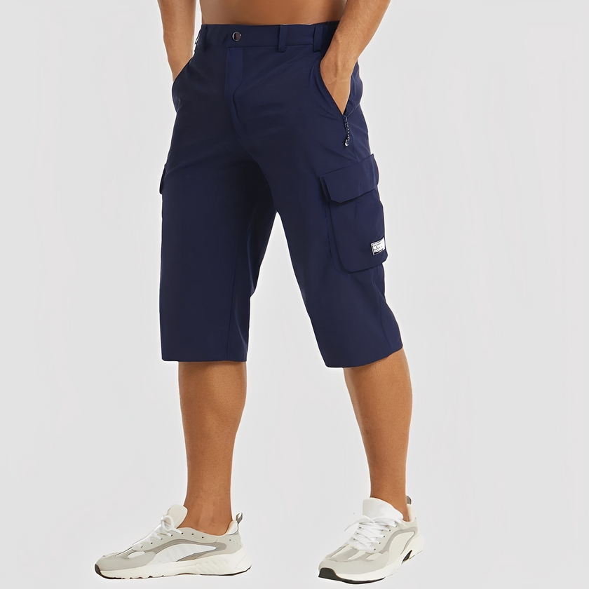 FJØRNA men's stretch cargo pants with multiple pockets, relaxed fit, and durable fabric for outdoor and casual wear.