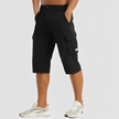 FJØRNA men's stretch cargo pants showing a relaxed fit with multiple utility pockets and durable fabric.