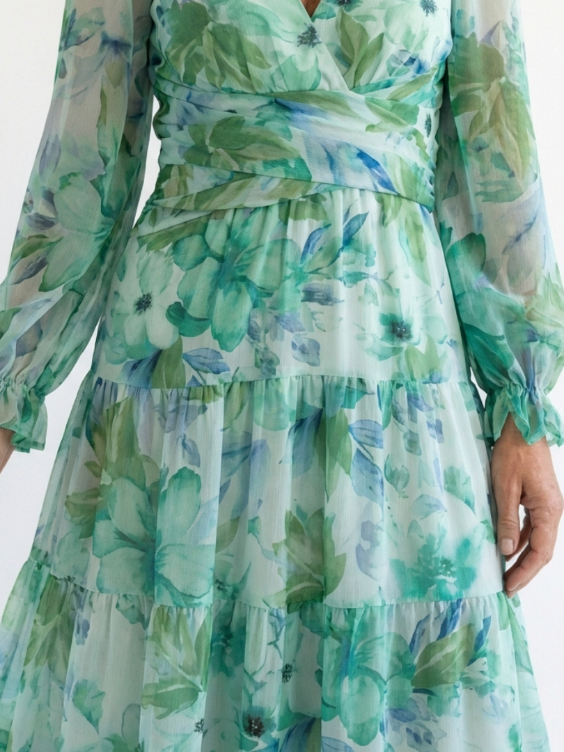 FJØRNA floral long sleeve maxi dress for women, elegant and flowing with a vibrant floral pattern and fitted waist.