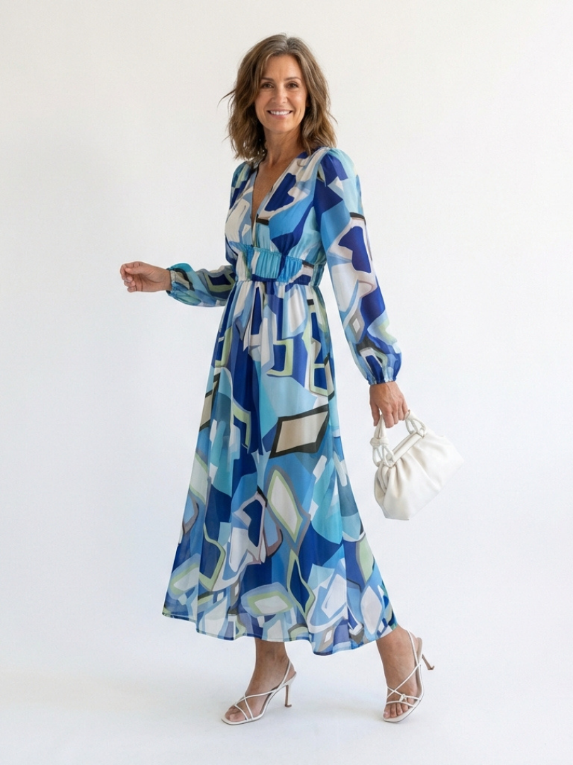 FJØRNA floral long sleeve maxi dress for women, elegant and flowing with a vibrant floral pattern and comfortable fit.