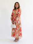FJØRNA elegant floral maxi dress for women with long sleeves, flowing fabric, perfect for stylish occasions.