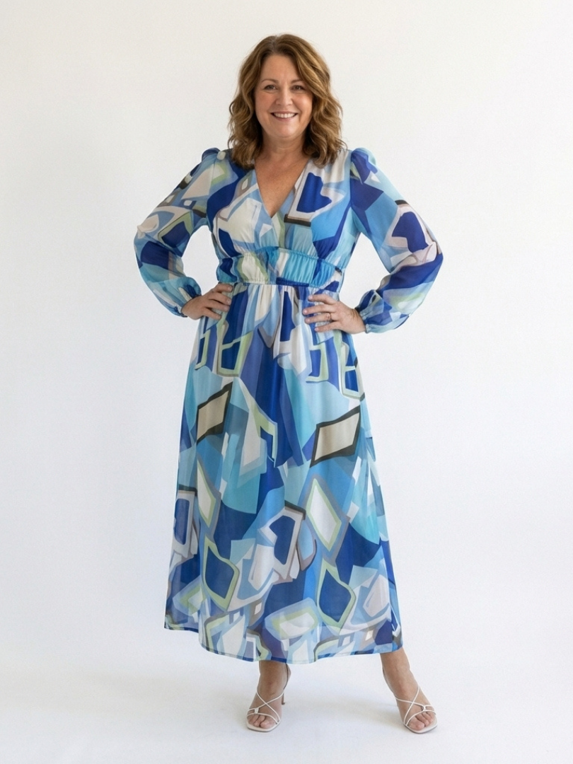 FJØRNA elegant floral maxi dress for women with long sleeves, flowing fabric, and a sophisticated design for special occasions.