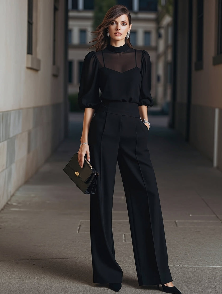 Black chiffon top and wide-leg trousers from FJØRNA three-piece pants set, shown on a model wearing stylish, elegant clothing.