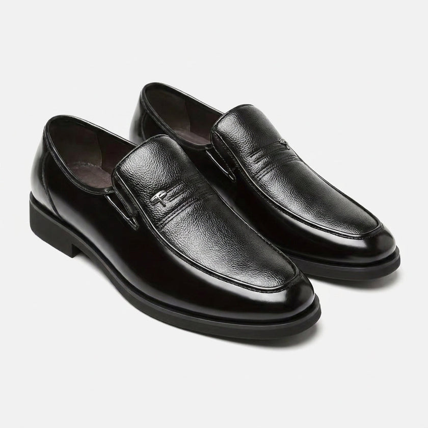 FJØRNA men's black leather slip-on loafers shown from an angled view, stylish and sleek men's business shoes.