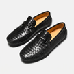 FJØRNA men's woven black leather slip-on driving loafers displayed at an angle, showcasing the textured woven design and sleek style.