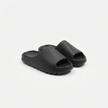 FJØRNA men's open toe slides slippers shown from an angled view, featuring a casual slip-on design and open-toe style.