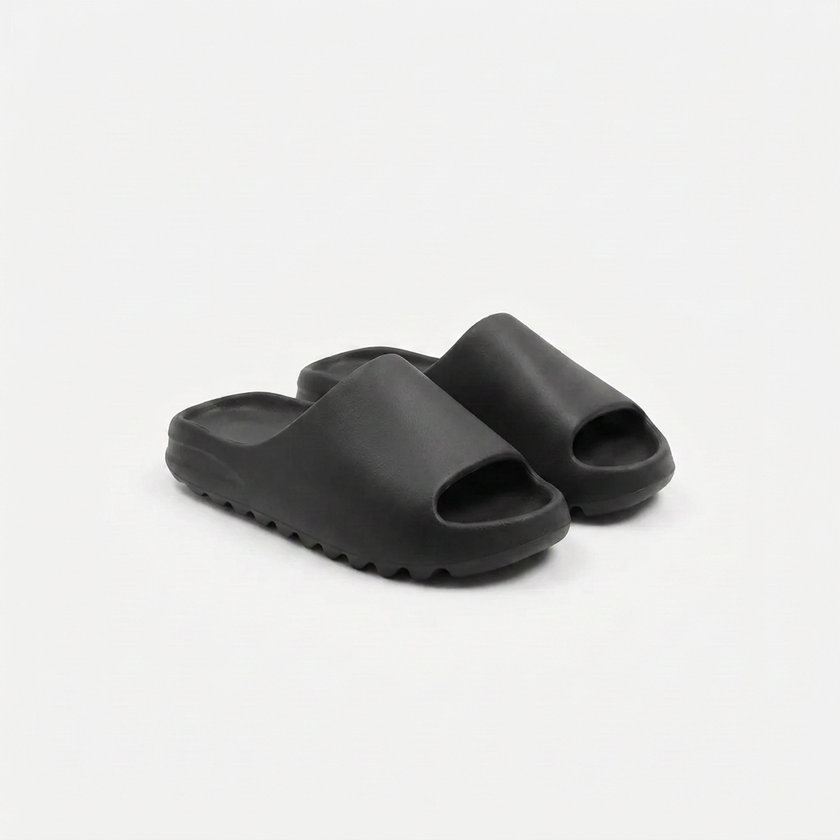 FJØRNA men's open toe slides slippers shown from an angled view, featuring a casual slip-on design and open-toe style.