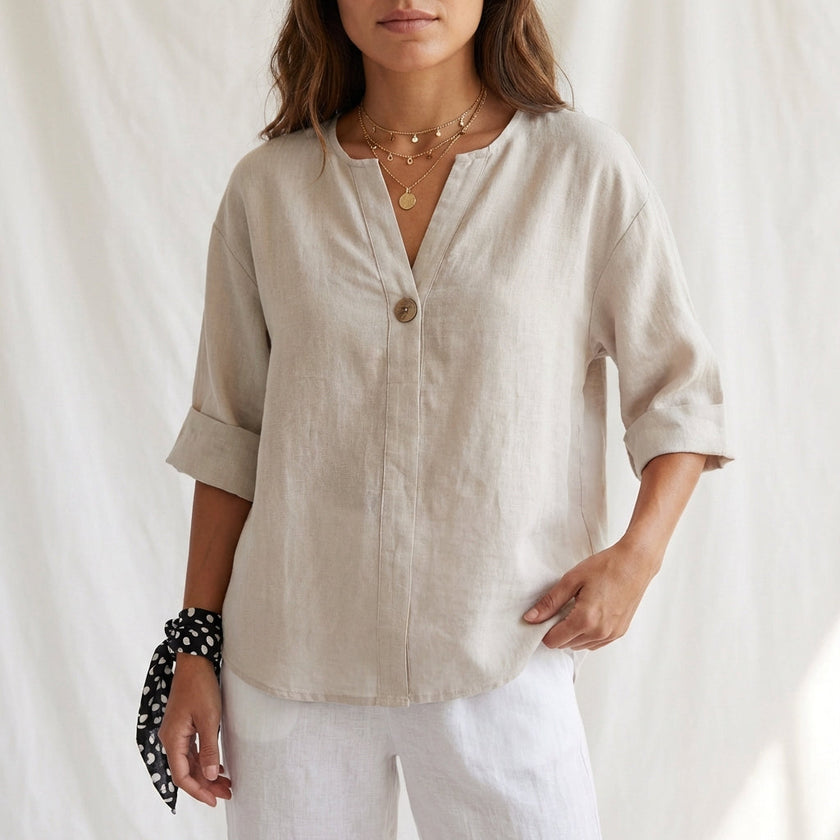Apricot women's summer blouse by FJØRNA with V-neck, linen fabric, and button front, stylish top for warm weather.