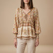 Apricot floral long sleeve linen blouse for women by FJØRNA, featuring a lightweight, breezy summer top with a feminine design.