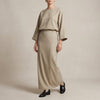 FJØRNA two-piece textured woven skirt suit in apricot with draped high-waist silhouette, featuring a stylish and elegant design.