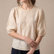 Apricot floral V-neck summer top for women by FJØRNA, lightweight blouse with a feminine floral pattern and relaxed fit.