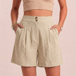 Apricot linen summer shorts for women by FJØRNA featuring high waist and breathable fabric with practical pockets.