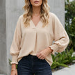 Apricot FJØRNA women's summer blouse with V-neck, denim ruffles, lightweight design, perfect for warm weather.