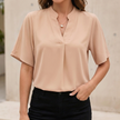 Apricot chiffon women's V-neck blouse with stand collar and split cuffs, stylish FJØRNA top with elegant design.