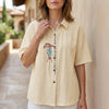 FJØRNA women's floral summer blouse in apricot denim with short sleeves, lightweight and stylish for warm weather.
