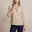 Apricot FJØRNA women's long sleeve smocked summer blouse with lightweight fabric and feminine design.