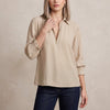 Apricot FJØRNA women's long sleeve smocked summer blouse with lightweight fabric and feminine design.