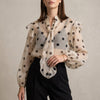 Apricot polka dot long sleeve summer blouse for women by FJØRNA, casual top with a relaxed fit and feminine style.