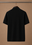 Men's luxury knit polo shirt by FJØRNA, soft textured breathable summer polo for stylish comfort.