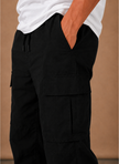 Men's FJØRNA cargo pants with a relaxed fit, featuring utility-style pockets and casual everyday wear design.