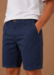 Men's FJØRNA chino shorts in cotton blend, tailored fit, perfect for smart casual wear, shown in a natural relaxed pose.
