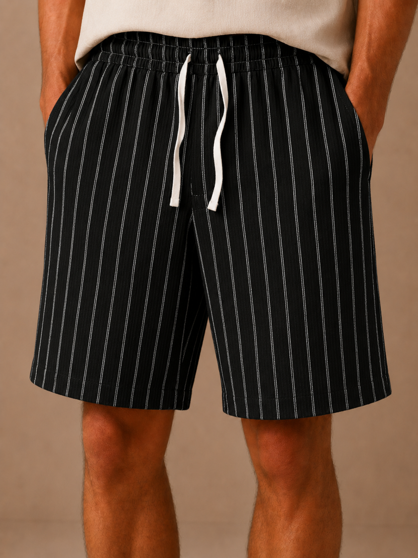 Men's linen drawstring shorts by FJØRNA featuring a relaxed fit with white stripes and a casual, breathable design.