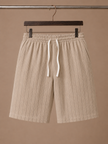Men's linen drawstring shorts by FJØRNA featuring a relaxed fit and white and striped pattern, casual style, lightweight fabric