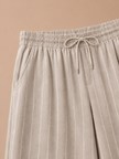 Men's striped linen drawstring trousers by FJØRNA with a relaxed casual fit, ideal for comfortable summer wear.