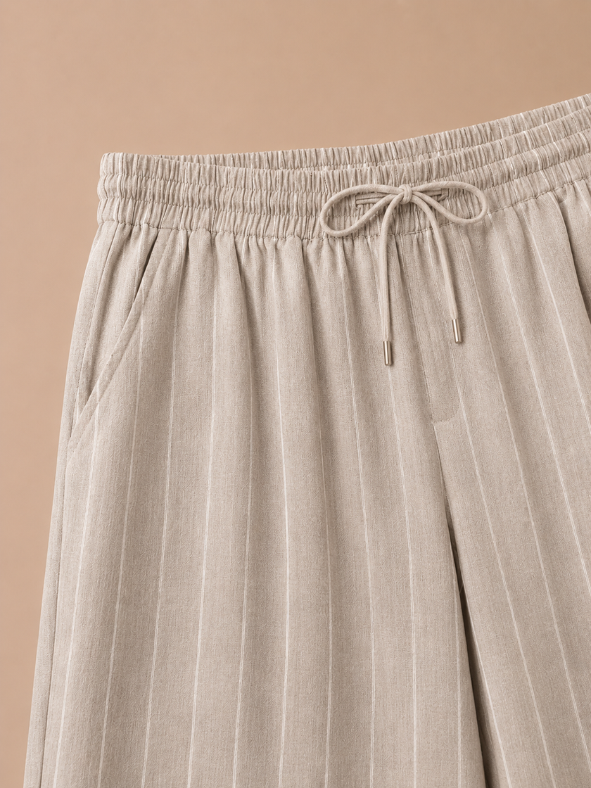 Men's striped linen drawstring trousers by FJØRNA with a relaxed casual fit, ideal for comfortable summer wear.