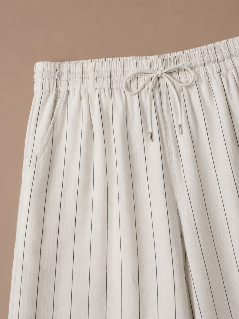Men's linen drawstring trousers by FJØRNA with relaxed fit and striped casual design, featuring a comfortable drawstring waistband.