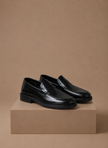 Men's leather penny loafers by FJØRNA featuring classic smart casual style, shown in a sleek black finish.