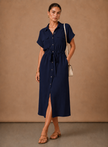 Elegant women's sleeveless formal dress by FJØRNA, lightweight and suitable for special occasions, shown on a model.