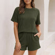 Army green FJØRNA ribbed knit two-piece set with relaxed drop shoulder top and mini shorts, casual and comfortable for everyday wear.