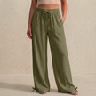 Army green women's linen summer trousers with pockets and drawstring waistband, by FJØRNA, casual and breathable for warm weather.