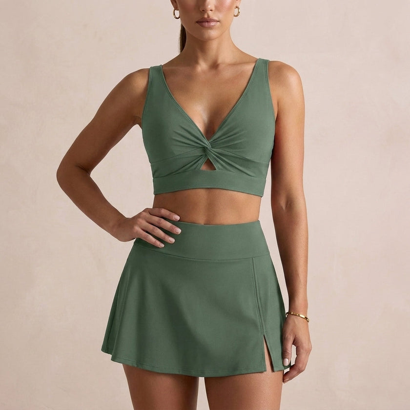 Army green women's summer bikini with V-neck and cut-out design from FJØRNA, showcasing the stylish swimwear on a model.