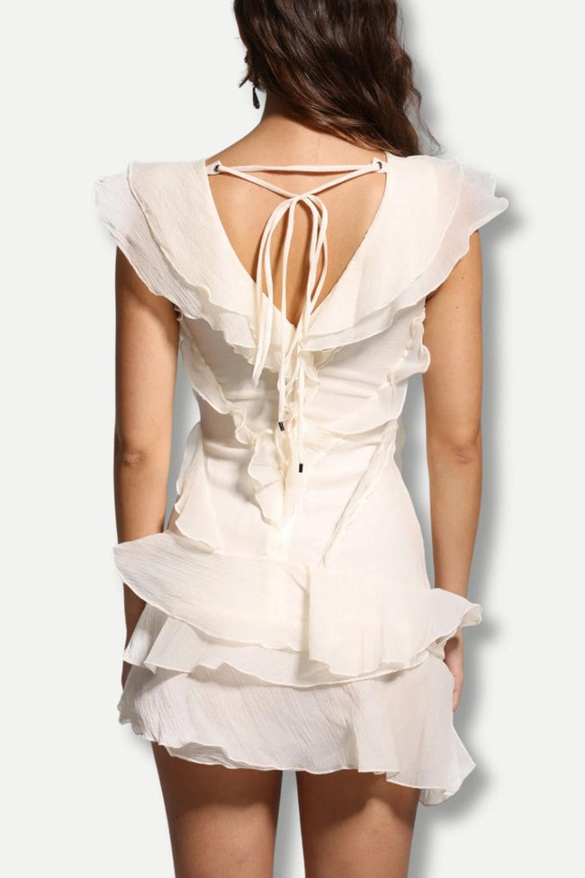 FJØRNA asymmetric ruffled mini dress for women, featuring a stylish design suitable for party and day wear.