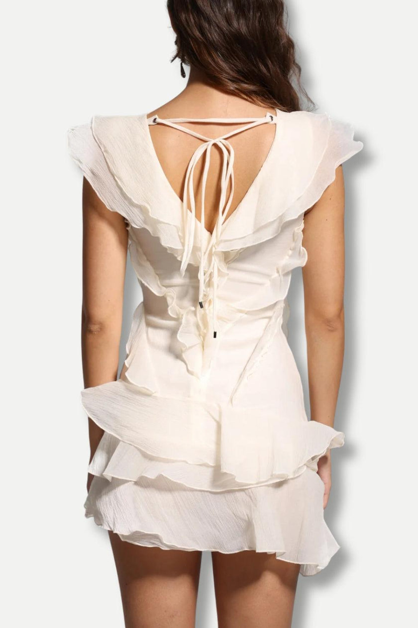 FJØRNA asymmetric ruffled mini dress for women, featuring a stylish design suitable for party and day wear.