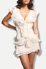 FJØRNA asymmetric ruffled mini dress for women, stylish party and day wear with uneven hem and feminine ruffle details.