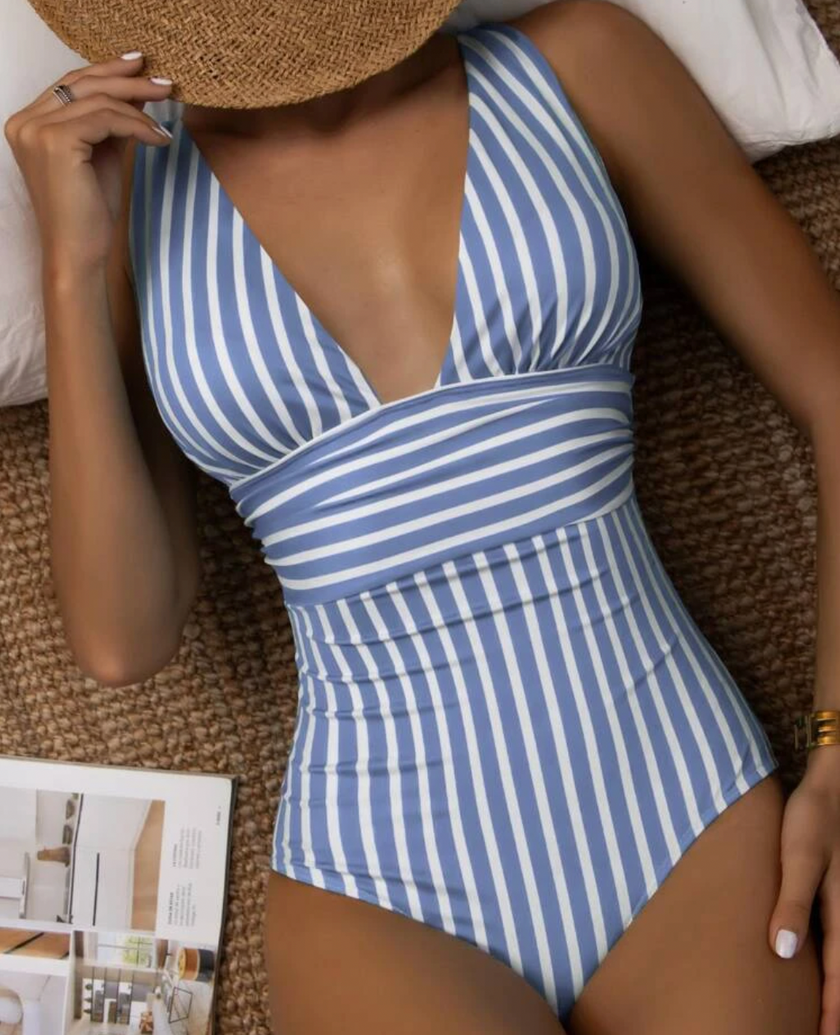 FJØRNA women's shaping swimsuit with elegant back design, featuring a figure-enhancing fit and stylish swimwear for women.