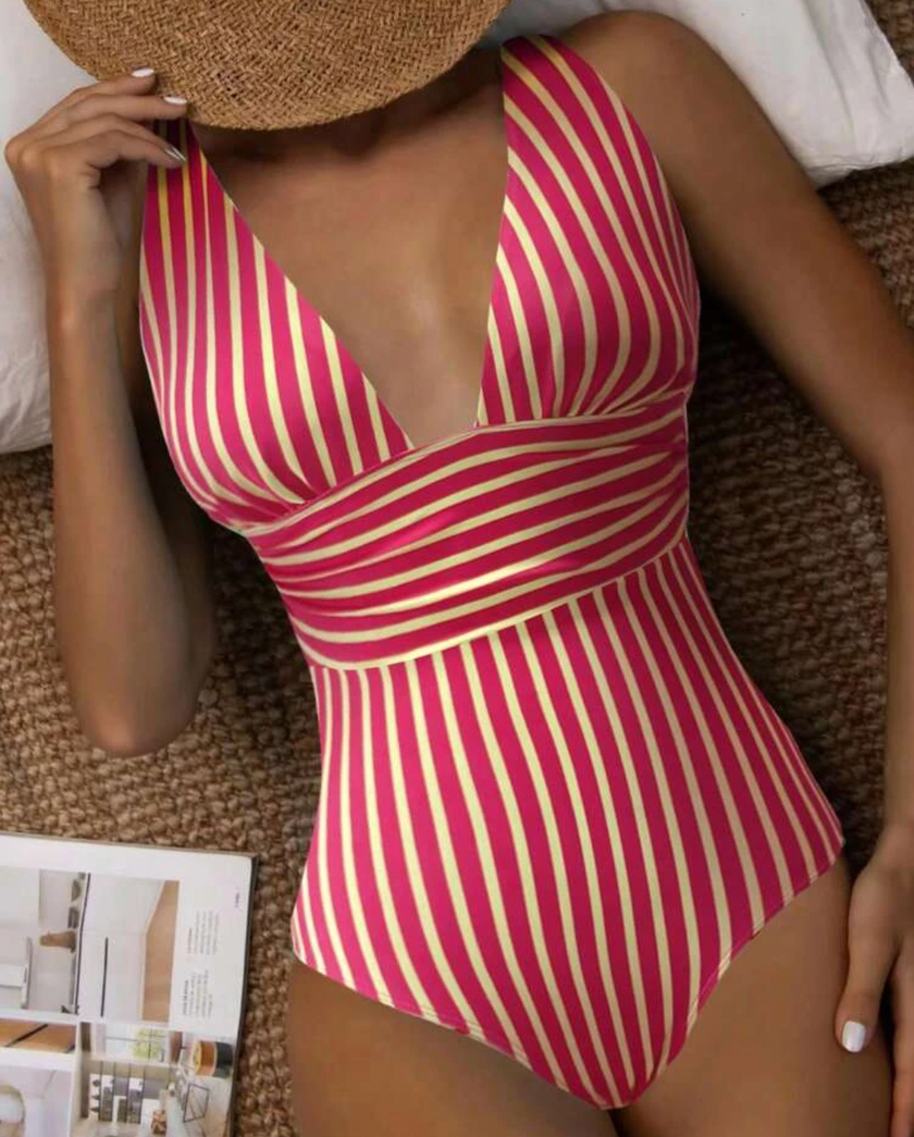FJØRNA women's shaping swimsuit with elegant back design, featuring a flattering fit and stylish details in a sleek swimwear style.