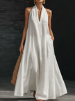 Women’s FJØRNA Aveline halter maxi dress with a flowy A-line silhouette and lightweight fabric, perfect for warm weather.
