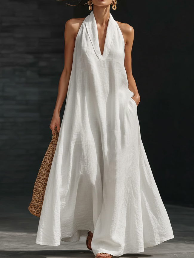 Women’s FJØRNA Aveline halter maxi dress with a flowy A-line silhouette and lightweight fabric, perfect for warm weather.