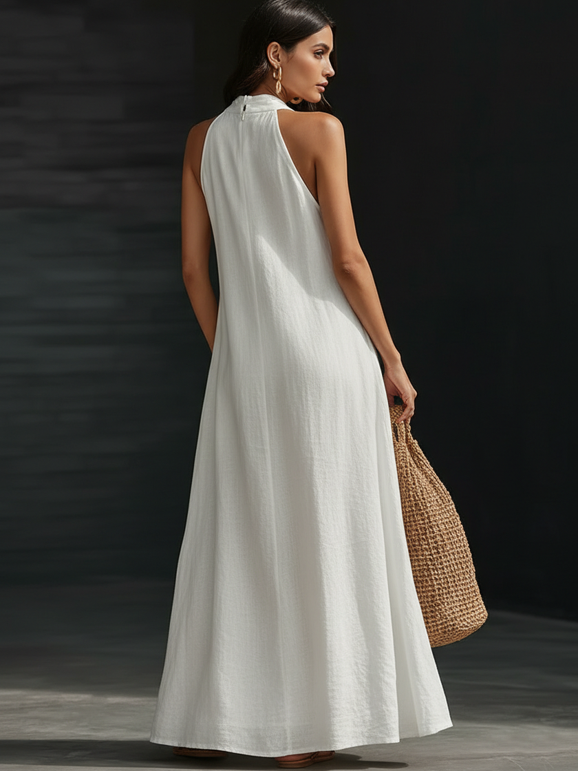 Women’s FJØRNA Aveline halter maxi dress with a flowy A-line silhouette and lightweight fabric, perfect for elegant summer wear.