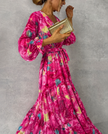 Elegant floral wrap dress for women by FJØRNA, showcasing a stylish design with a fitted waist and flowing fabric.